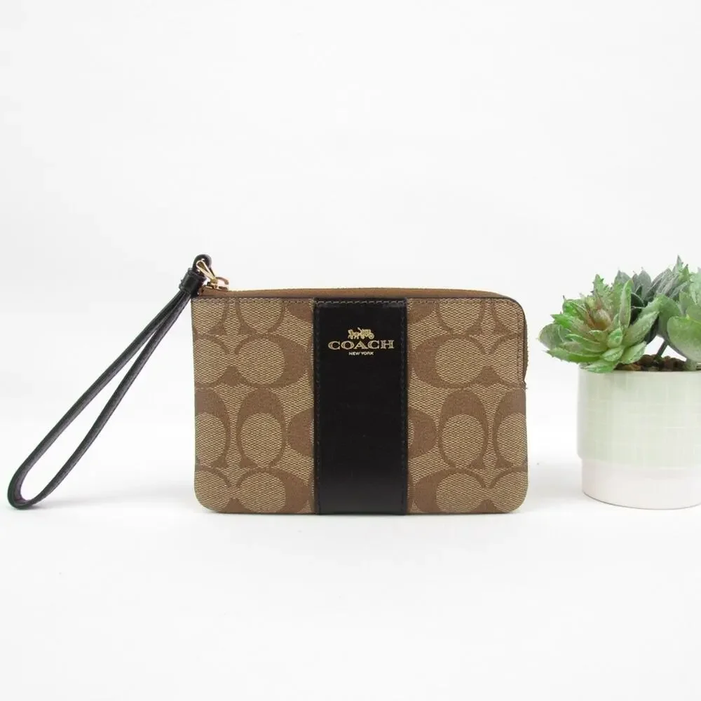 Coach Corner Zip Wristlet In Signature Canvas